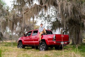 High school senior posing with their truck during a custom senior session in Southeast Georgia. Also serving Northeast Florida