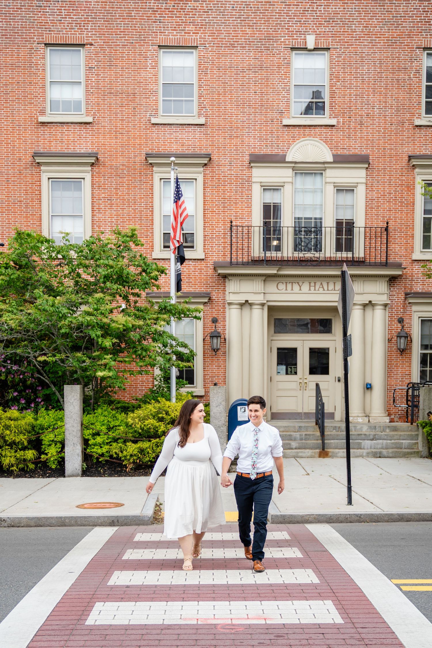 LGBTQ+ couple leaving Beverly City Hall after a courthouse wedding in Beverly, MA.