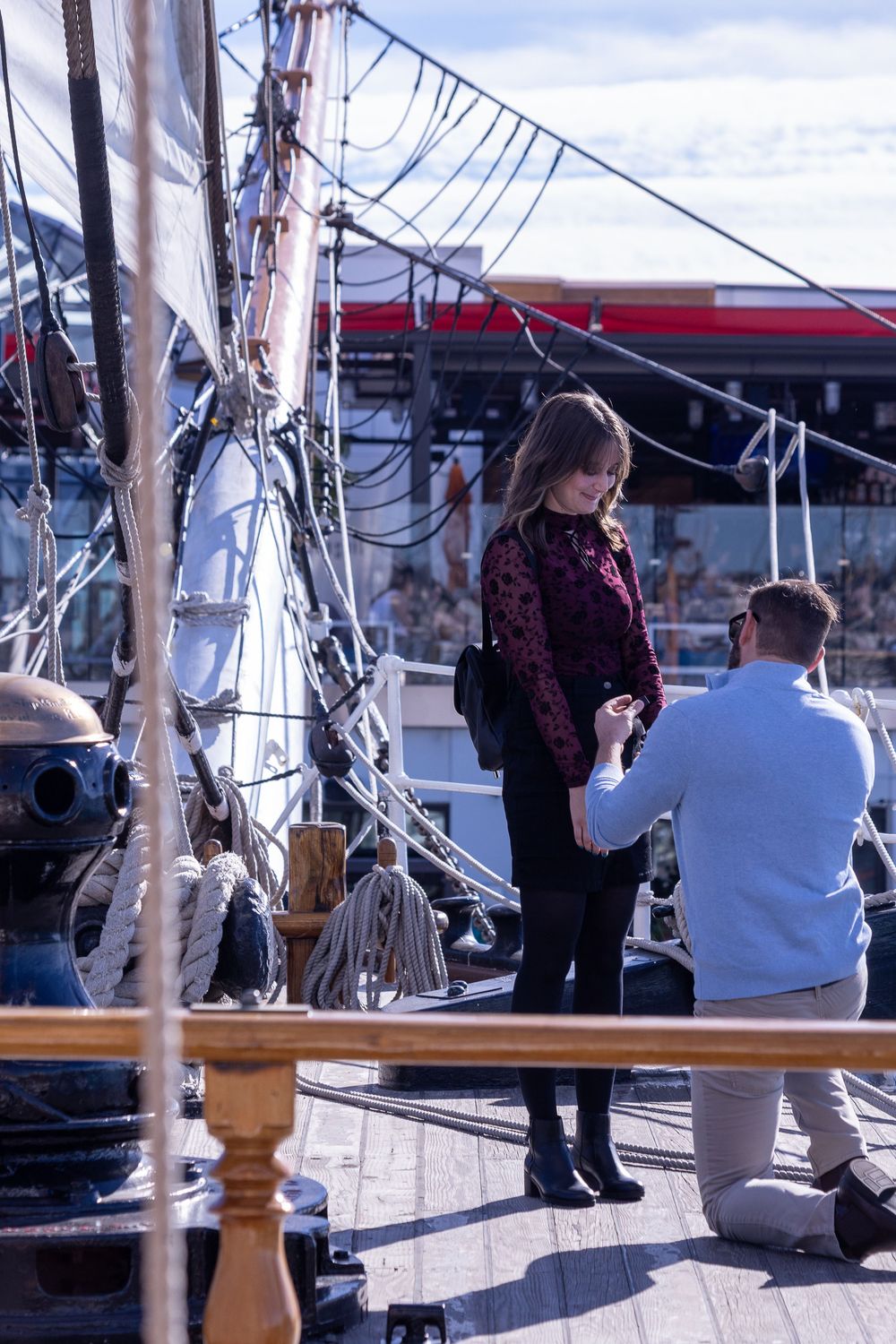 Couple standing together aboard a historic ship in San Diego photographed by Zeus Holbrook Wedding Photographer