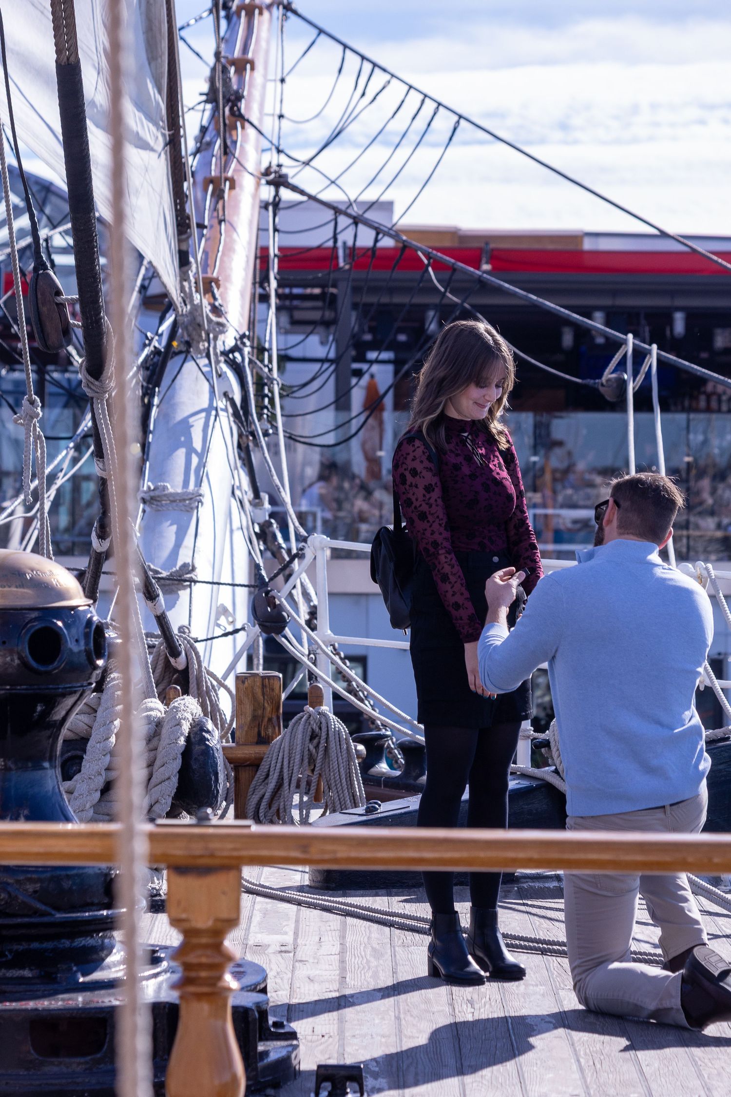 Couple standing together aboard a historic ship in San Diego photographed by Zeus Holbrook Wedding Photographer