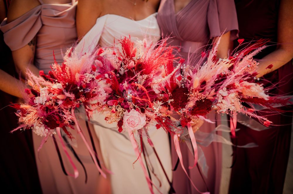 Glowing pink and red fiber optic decorative lights create a vibrant display against a dark background.