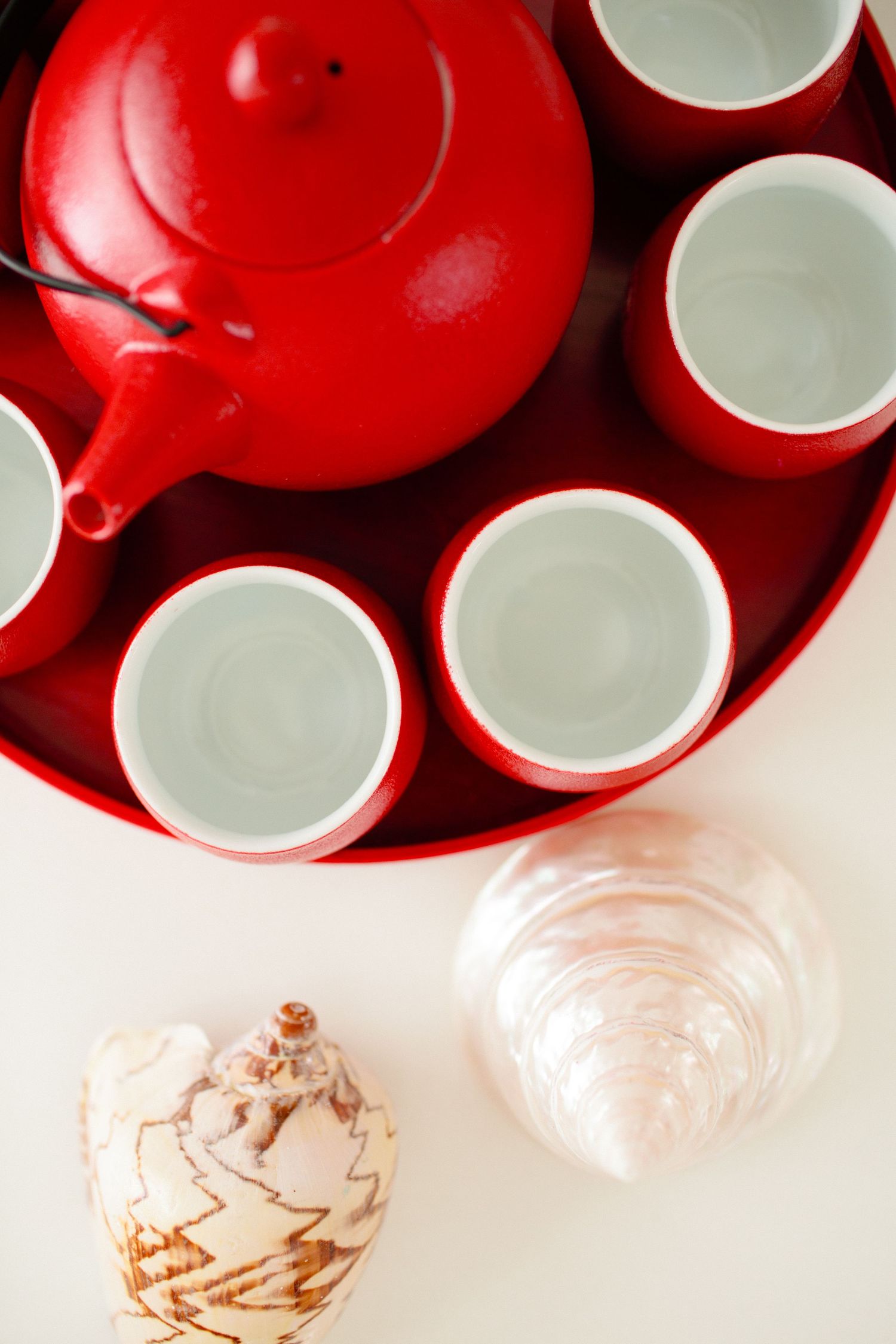 Chinese tea ceremony set with red teapot and cups, traditional wedding ritual detail at Ban Suriya Koh Samui