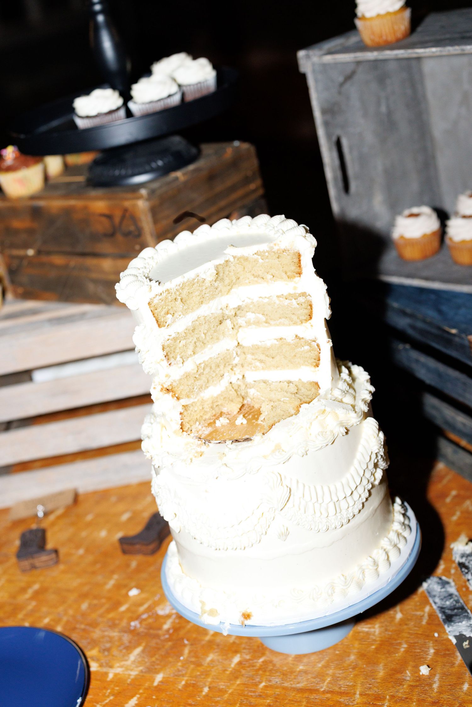 A sequence of photos showing a white frosted cake being progressively eaten or cut into smaller portions.