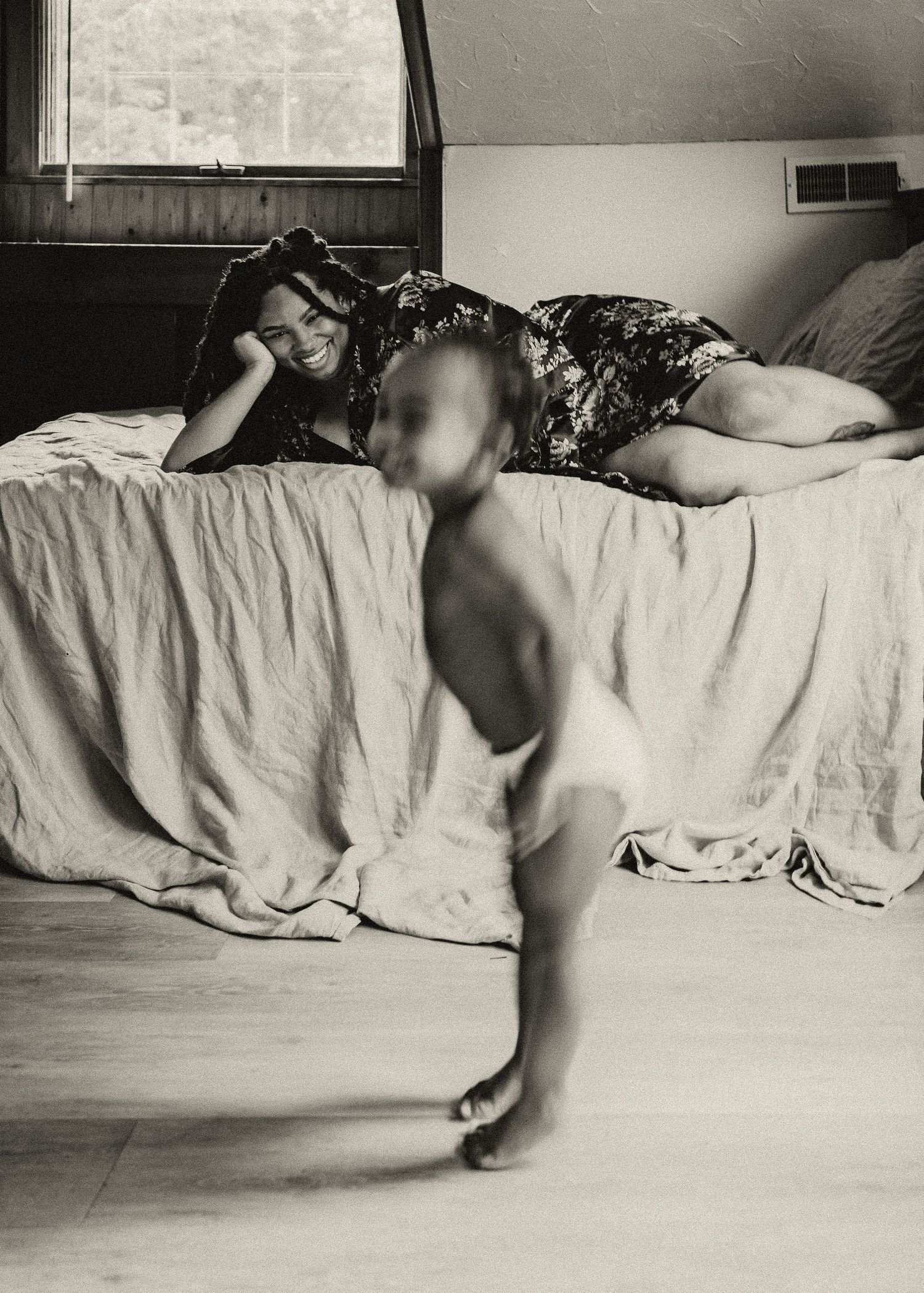 A sequence of black and white photos showing a person sitting on a couch and interacting with others in a living room setting.