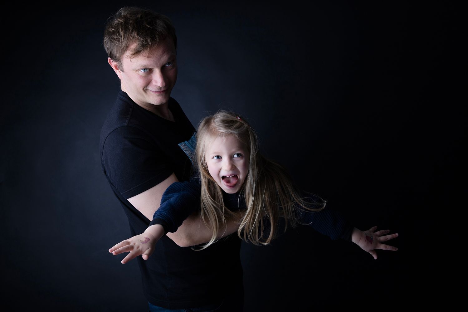 Dramatic portrait series showing emotional expressions and movements against dark background with moody lighting.
