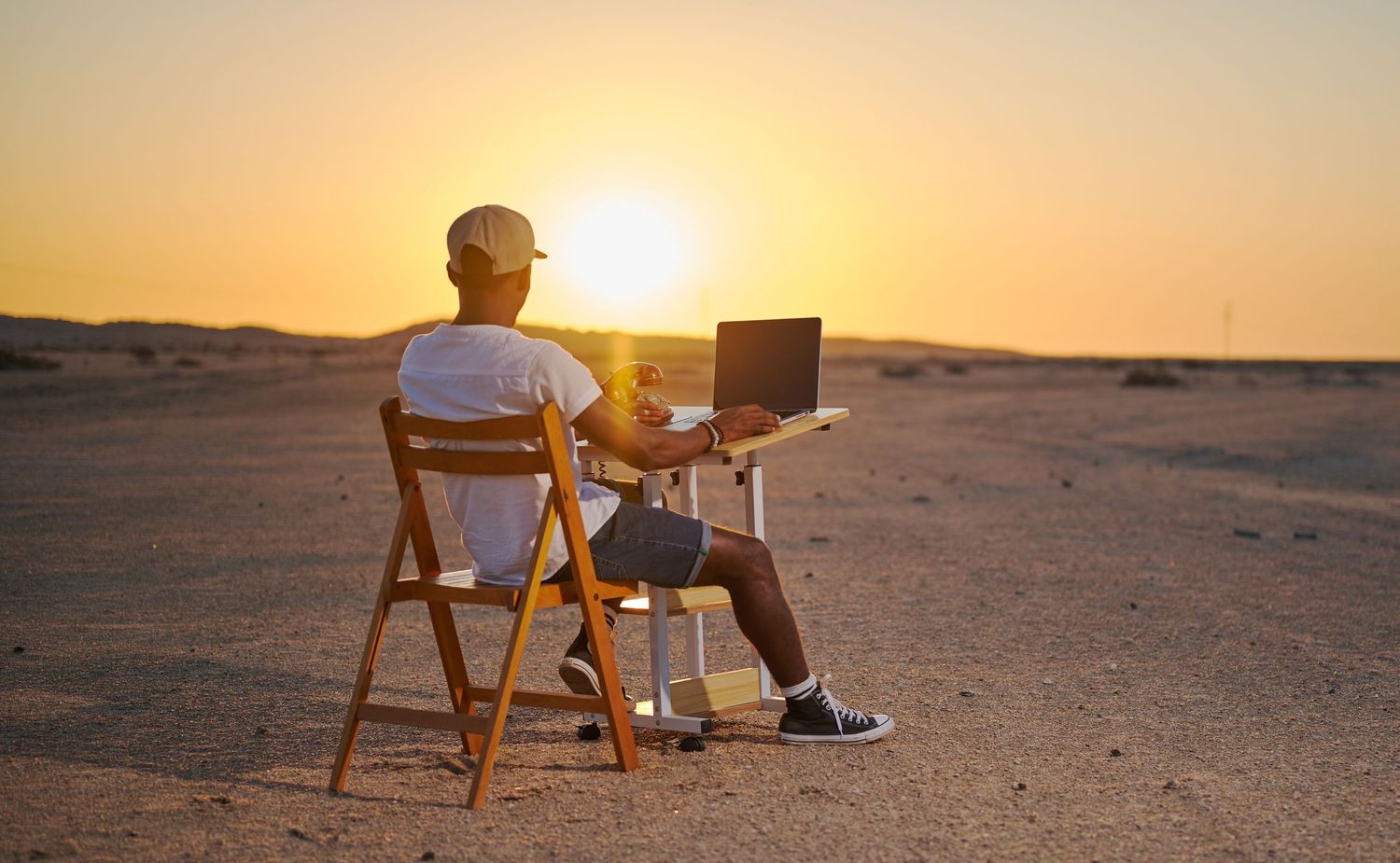 bay loft studio founder seating staring at the sunset