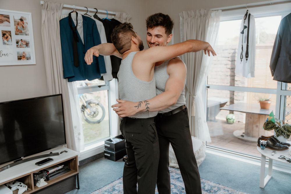 Intimate dancing moment captured in casual home setting.