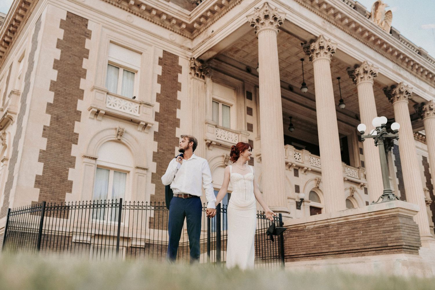Warm sunlight illuminating engaged couple in Dallas