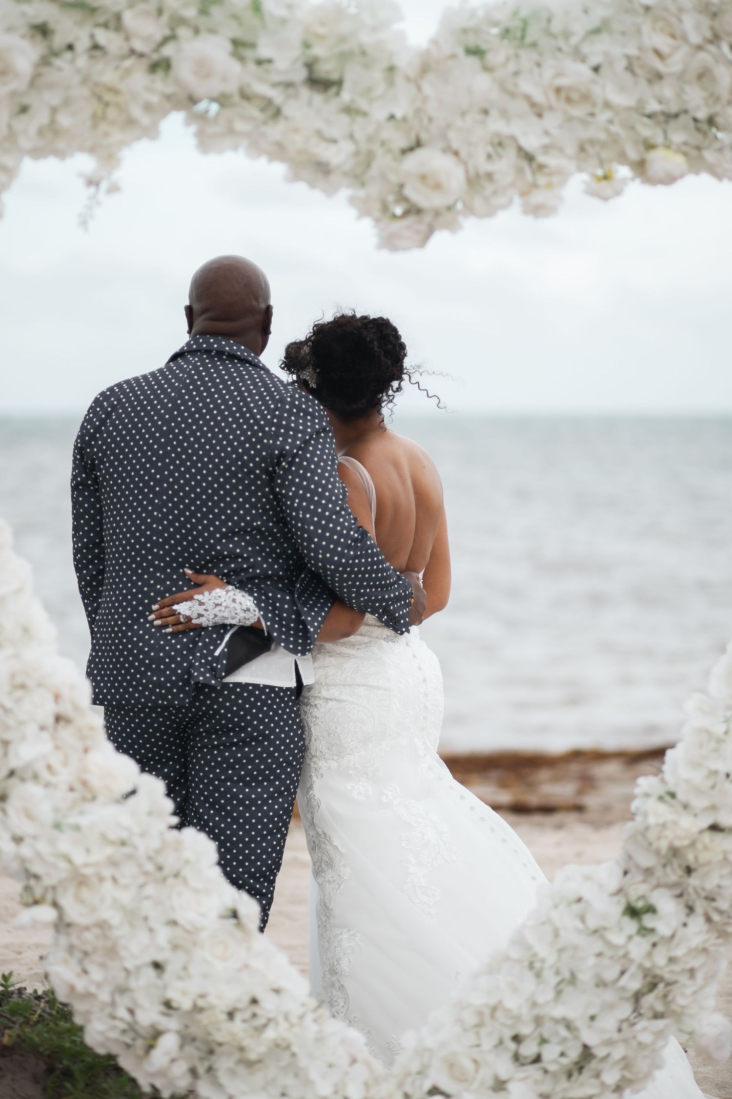 Newlywed couple embracing in elopement wedding at Crandon Park Miami.