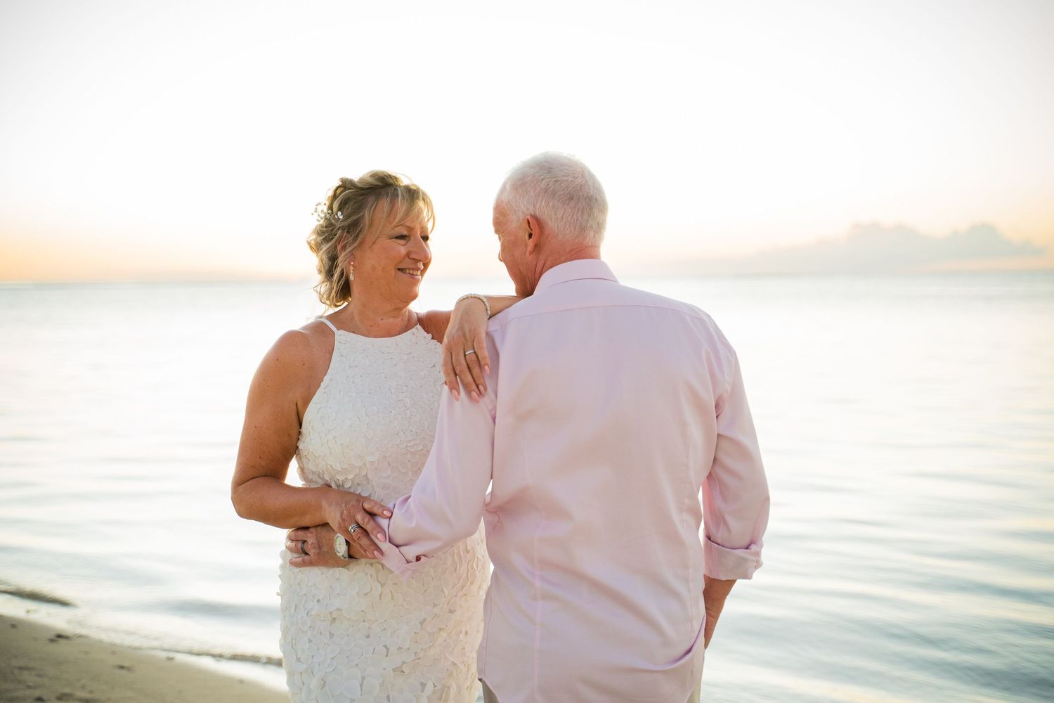 Bride laughing naturally with groom during destination wedding photography session in Mauritius