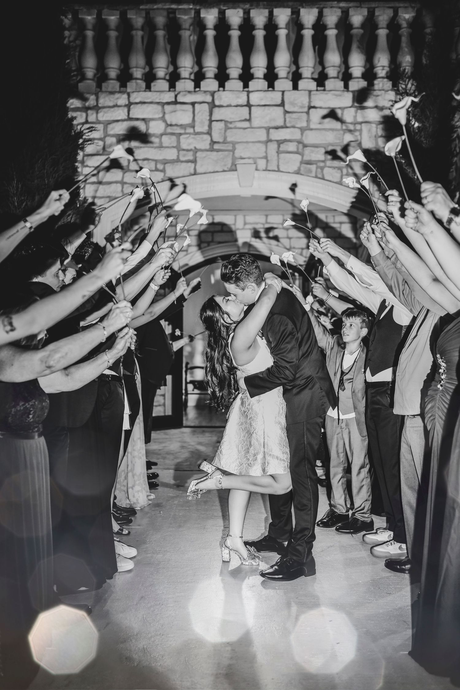 newlyweds kiss passionately during their grand exit from brighton abbey