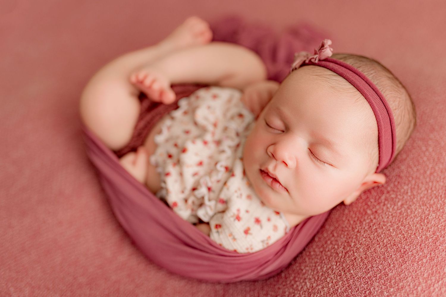 Newborn photography session with baby girl on pink with Tiffany Bergamino Photography in Marion Indiana