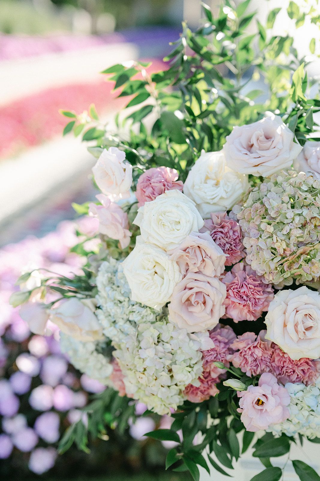 Armour House Wedding - Elegant formal garden with manicured lawns, fountains, floral borders, and a gazebo under a bright blue sky.