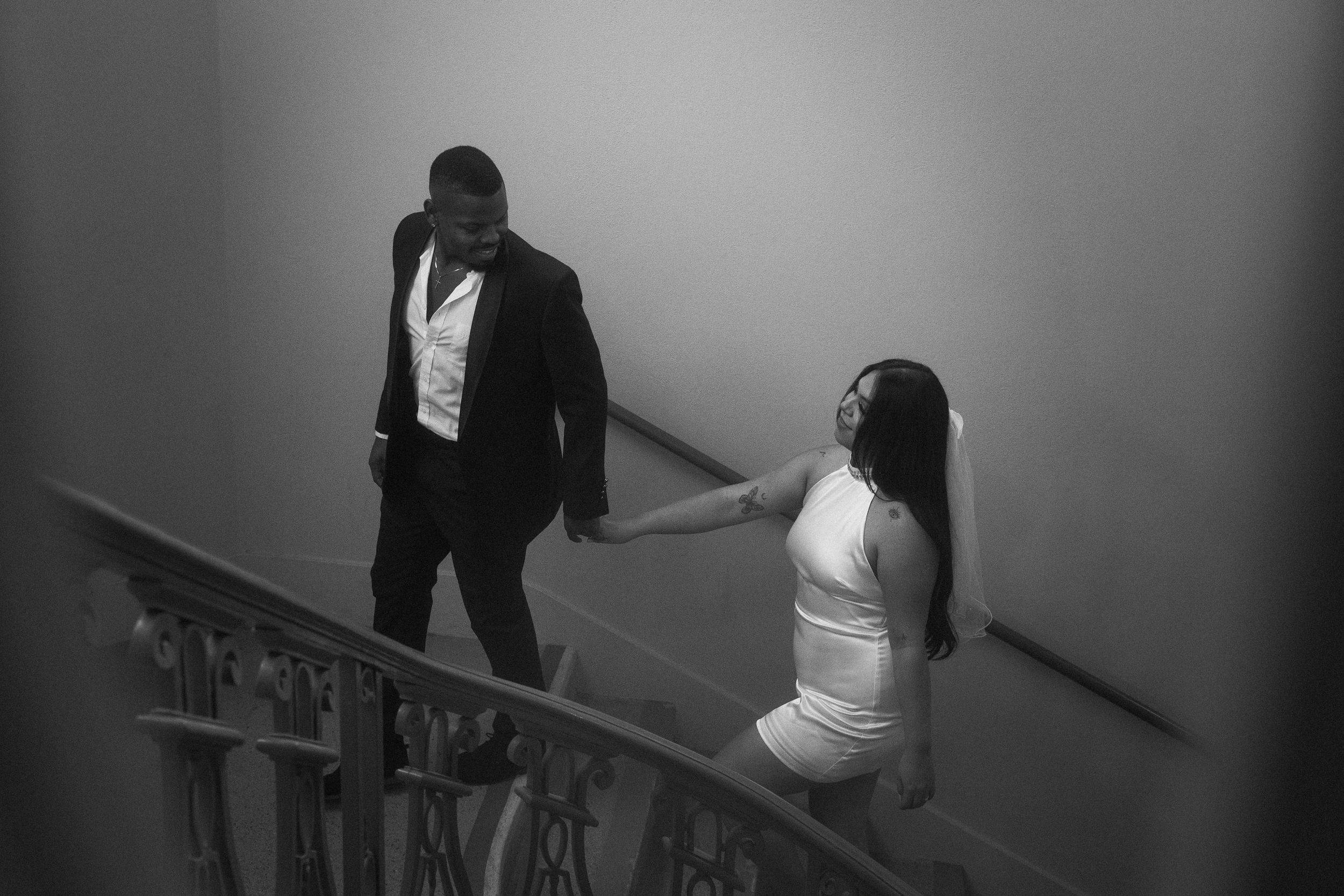 Emotional couple portrait under Pasadena City Hall’s arches