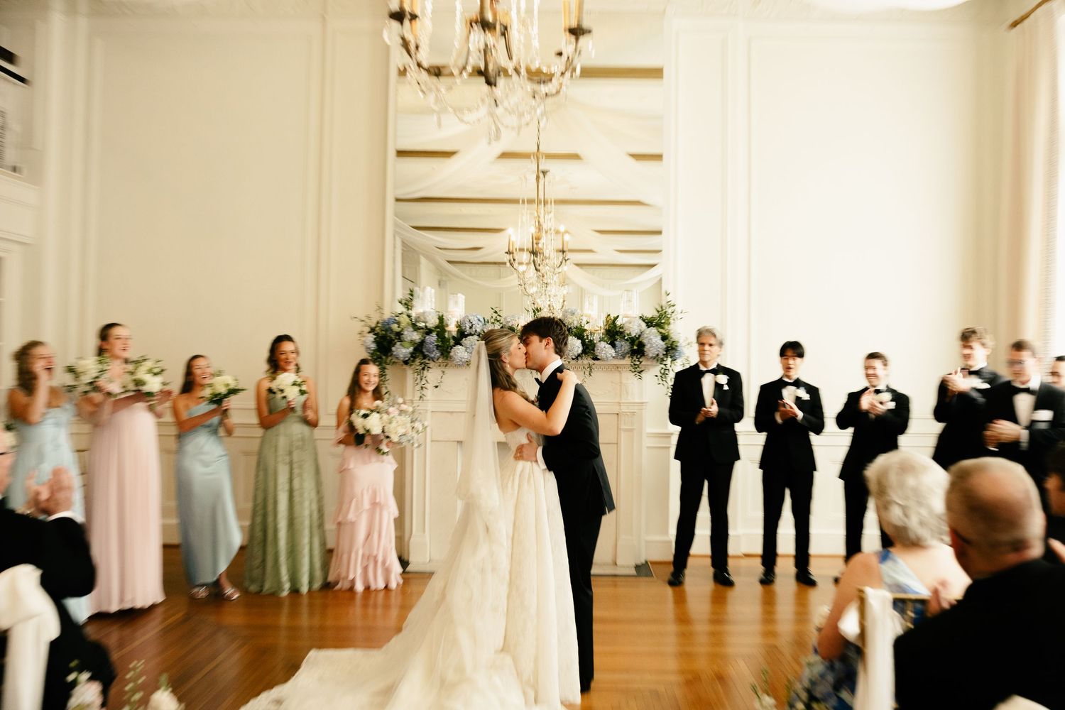 Bride and groom's first kiss at Hotel Concord in NC.