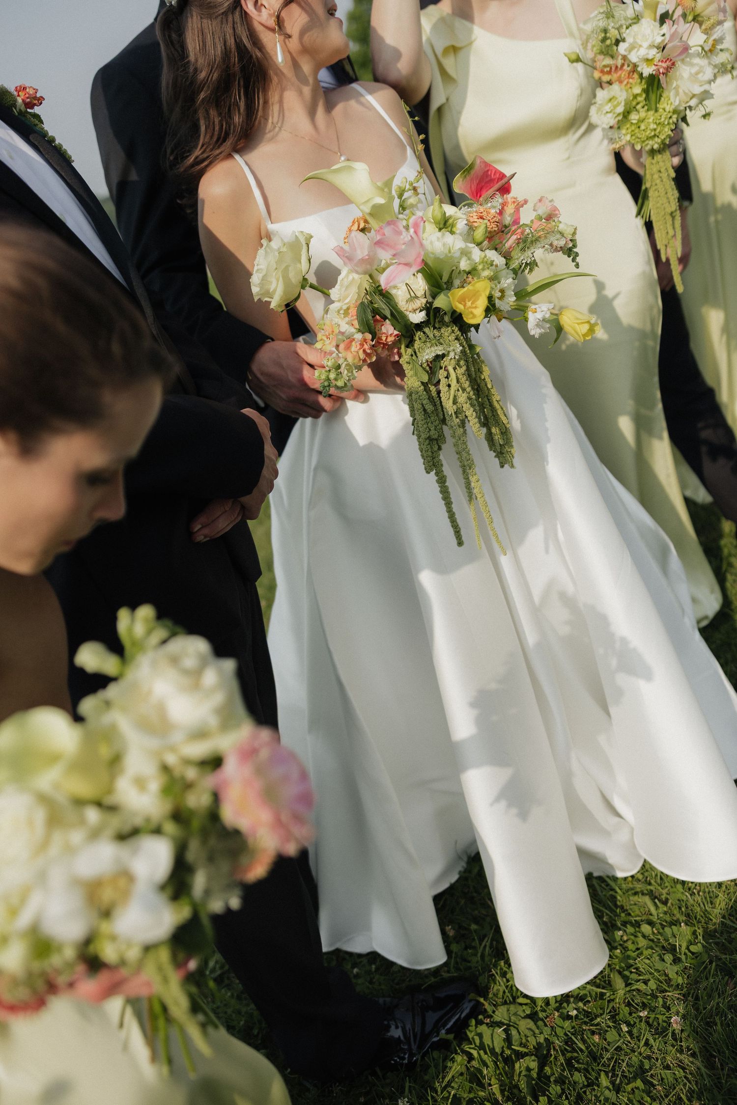 Bride and groom kissing under bride's wedding veil