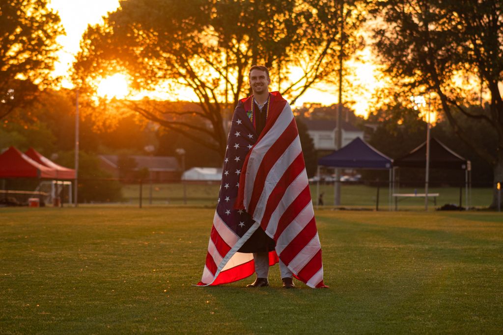 Sunset American flag graduation photo