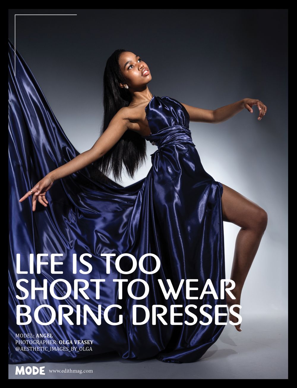 Fashion advertisement showing flowing navy blue evening gown with inspirational text.