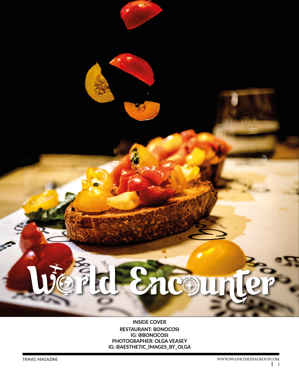 Artistic food photography of colorful bruschetta with floating ingredients against black background.