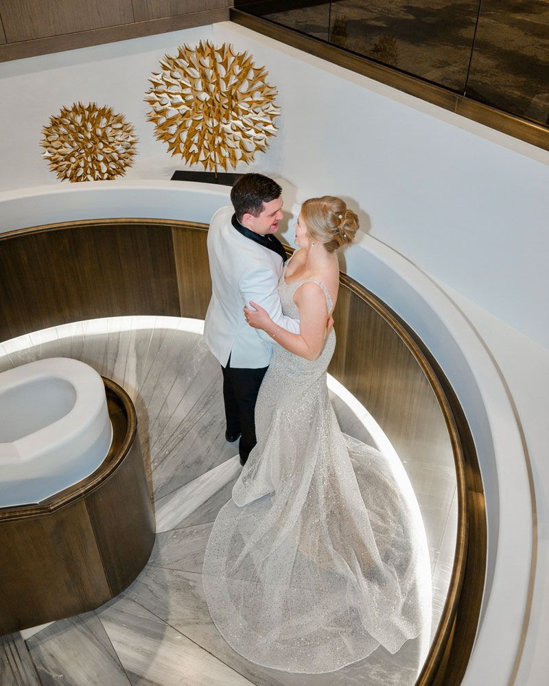 Bride and groom celebrating their wedding reception at JW Marriott Edmonton, surrounded by love and elegance.