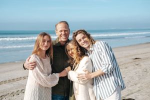 Family of four looking out at ocean in Coronado CA