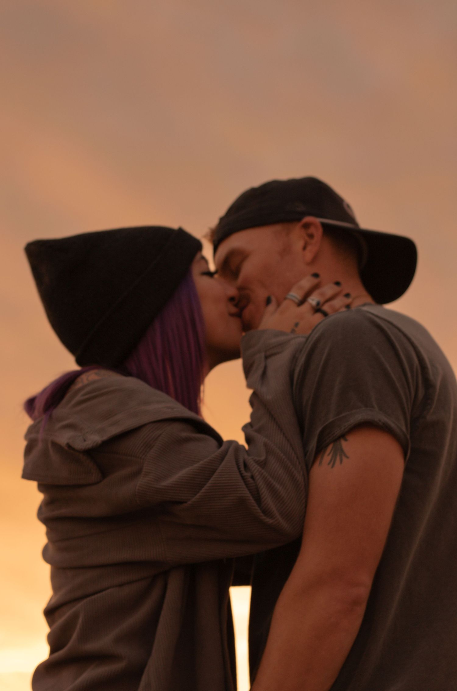 Couple photo session at sunset in the Greater Phoenix area, capturing a romantic moment with warm, glowing desert light.