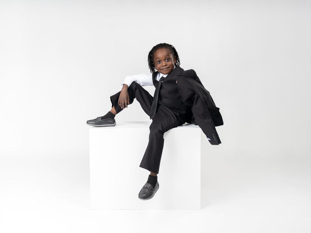 Professional studio photoshoot against white background showing dynamic poses in formal attire.