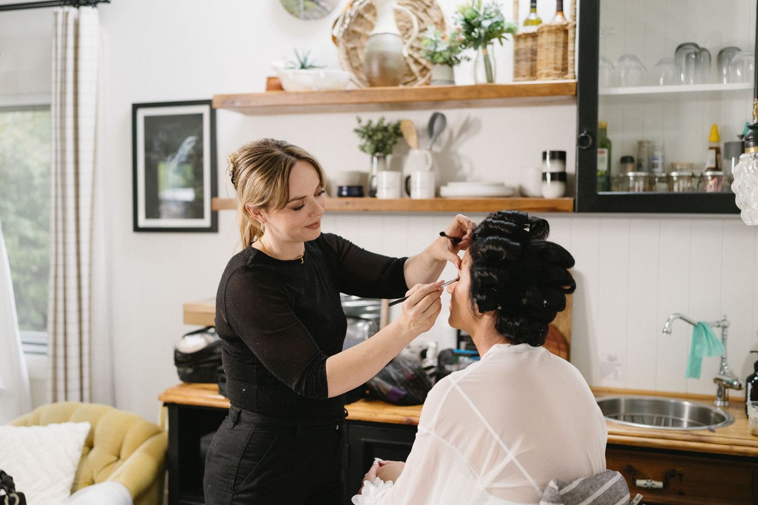 A styling session in progress in a modern kitchen setting.