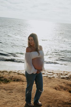 Maternity session on the beach in La Jolla with dog