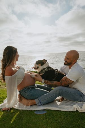 Maternity session on the beach in La Jolla with dog