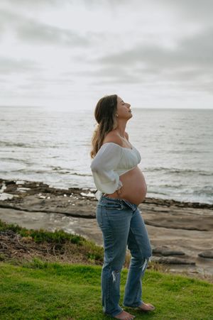 Maternity session on the beach in La Jolla with dog