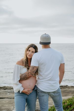 Maternity session on the beach in La Jolla with dog