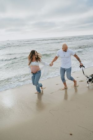 Maternity session on the beach in La Jolla with dog