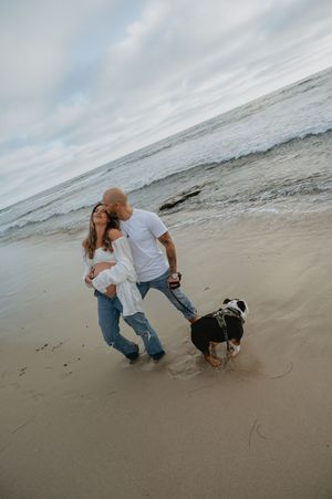Maternity session on the beach in La Jolla with dog