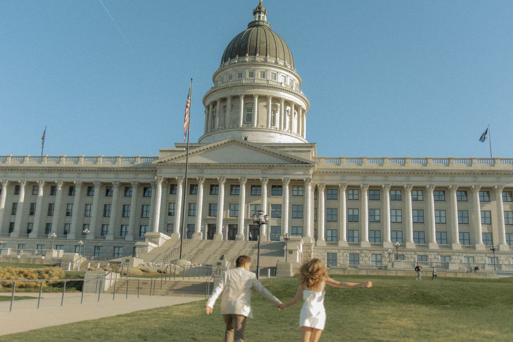 Cherry blossom engagement session at the Utah State Capitol captured by cinematic and documentary-style photographer Julia Fay Photo.