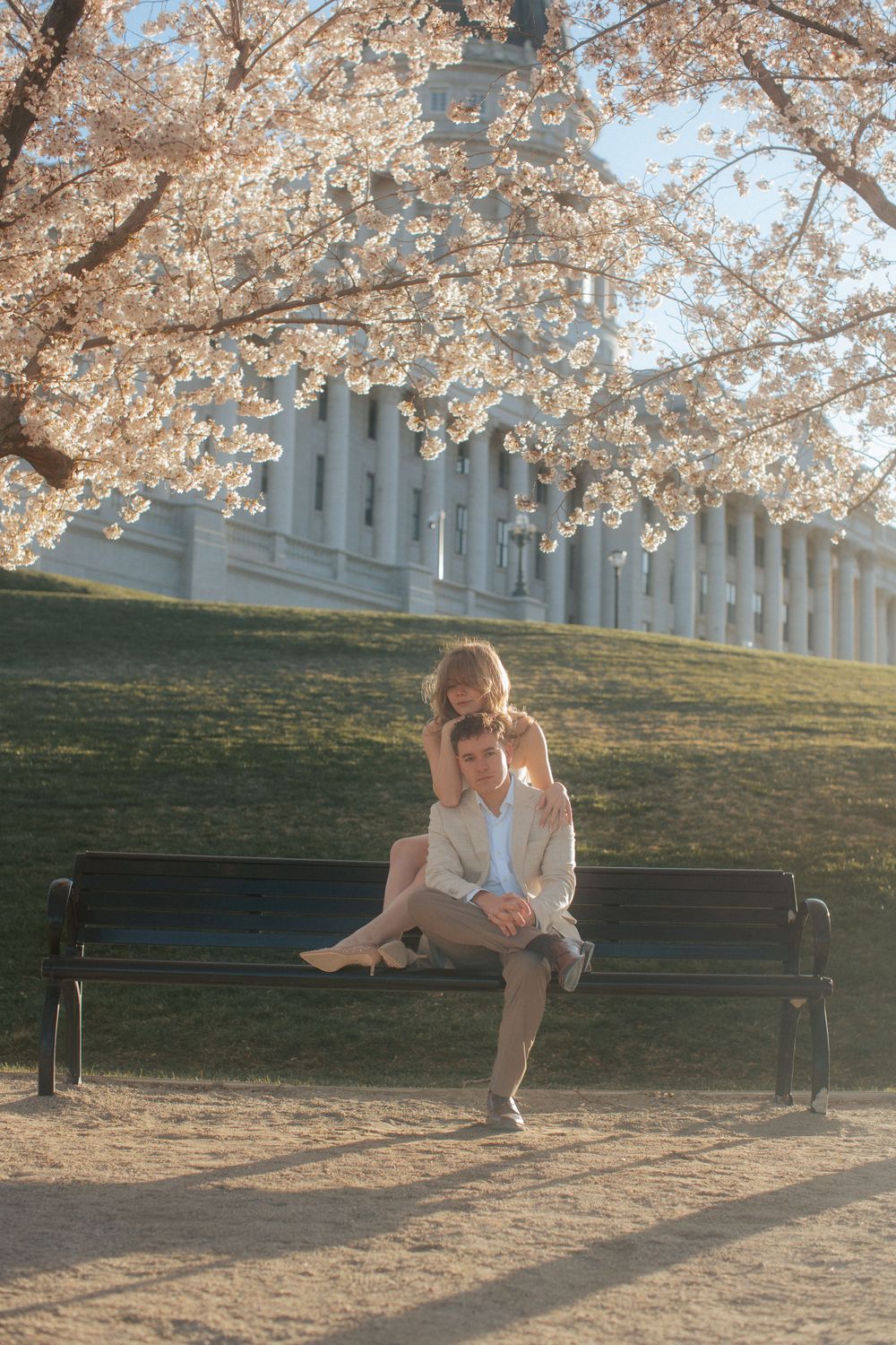 Cherry blossom engagement session at the Utah State Capitol captured by cinematic and documentary-style photographer Julia Fay Photo.