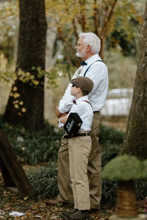 A series of photos showing a father in khaki shorts and white shirt standing thoughtfully in a wooded outdoor setting with ring bear.