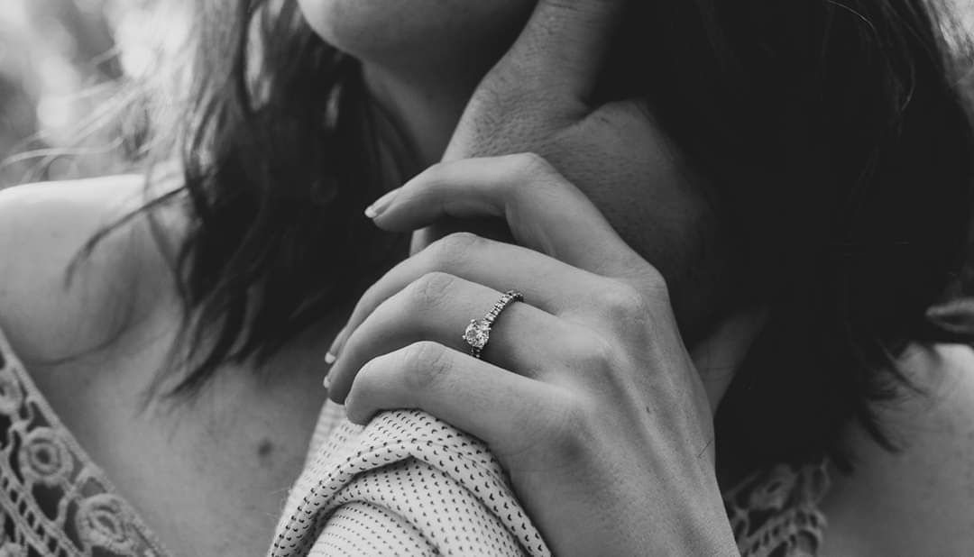 A series of black and white intimate photographs showing tender moments between a couple.