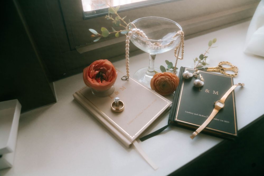 Film photography equipment and accessories displayed on a white windowsill.