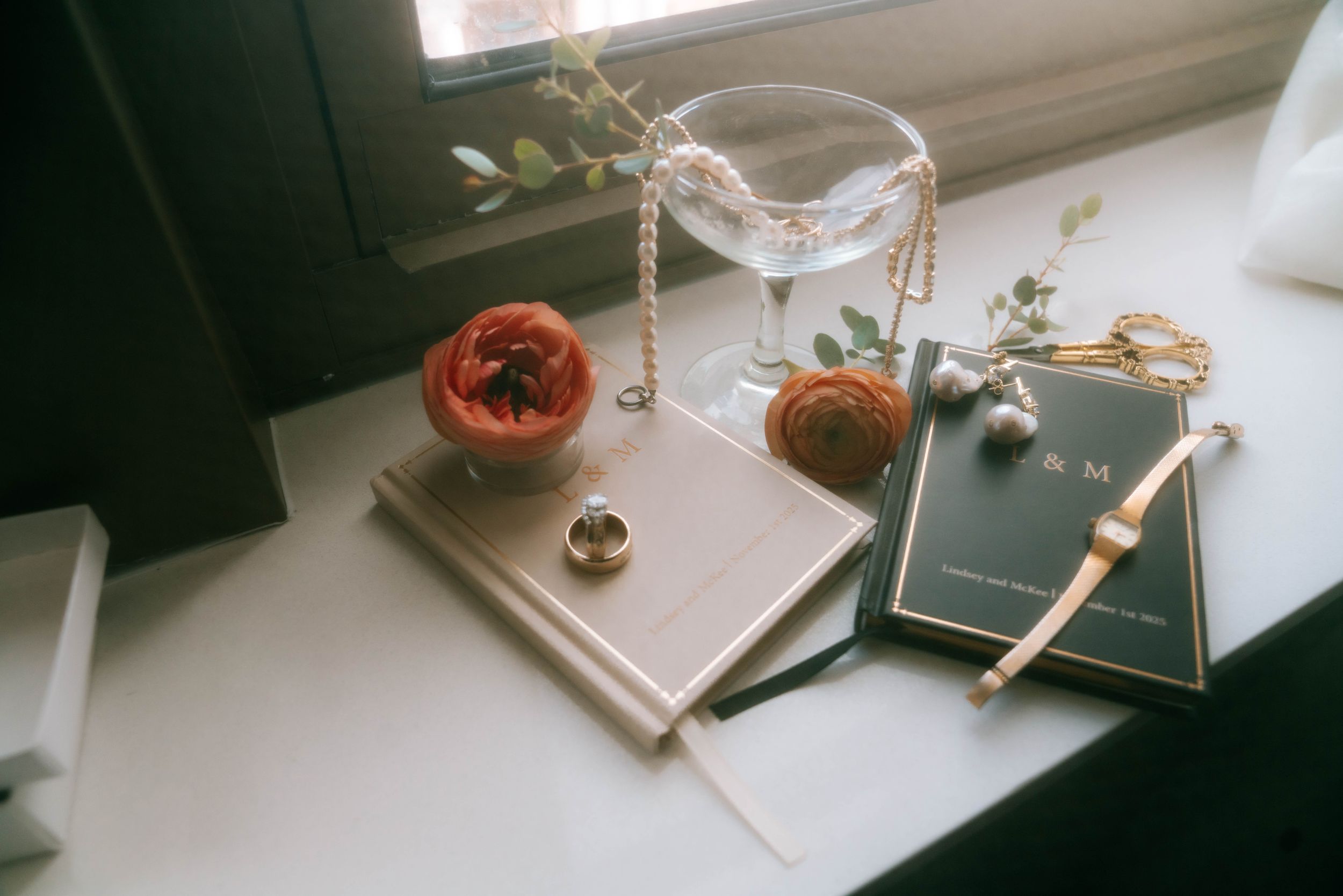 Film photography equipment and accessories displayed on a white windowsill.