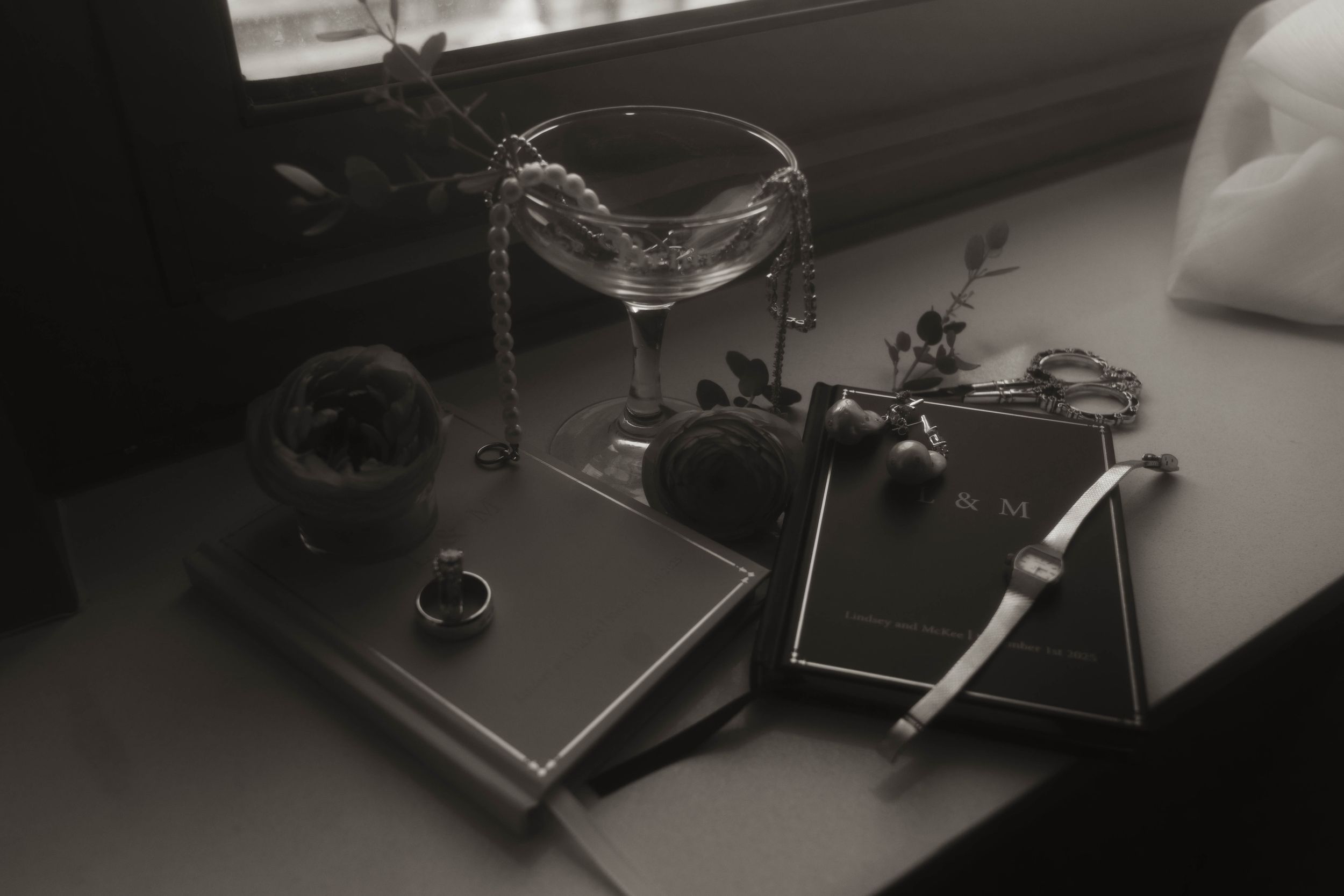 Vintage camera equipment and accessories arranged on a dark surface.