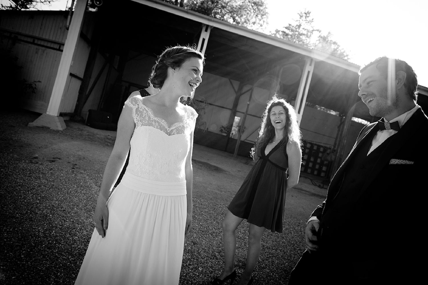 A series of black and white wedding photos showing intimate moments during an outdoor ceremony and celebration.