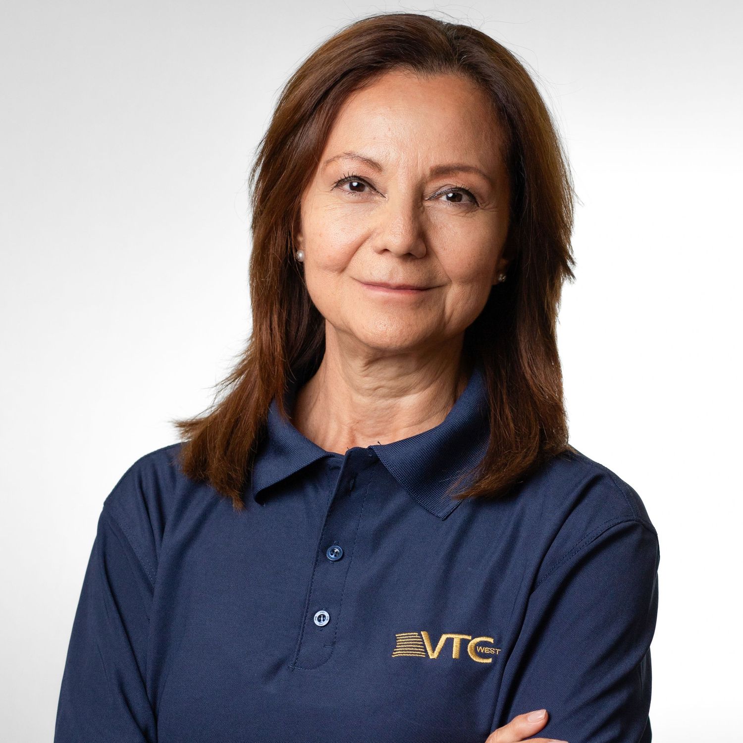 Professional headshot series showing person in navy blue polo with VTC logo against white background.