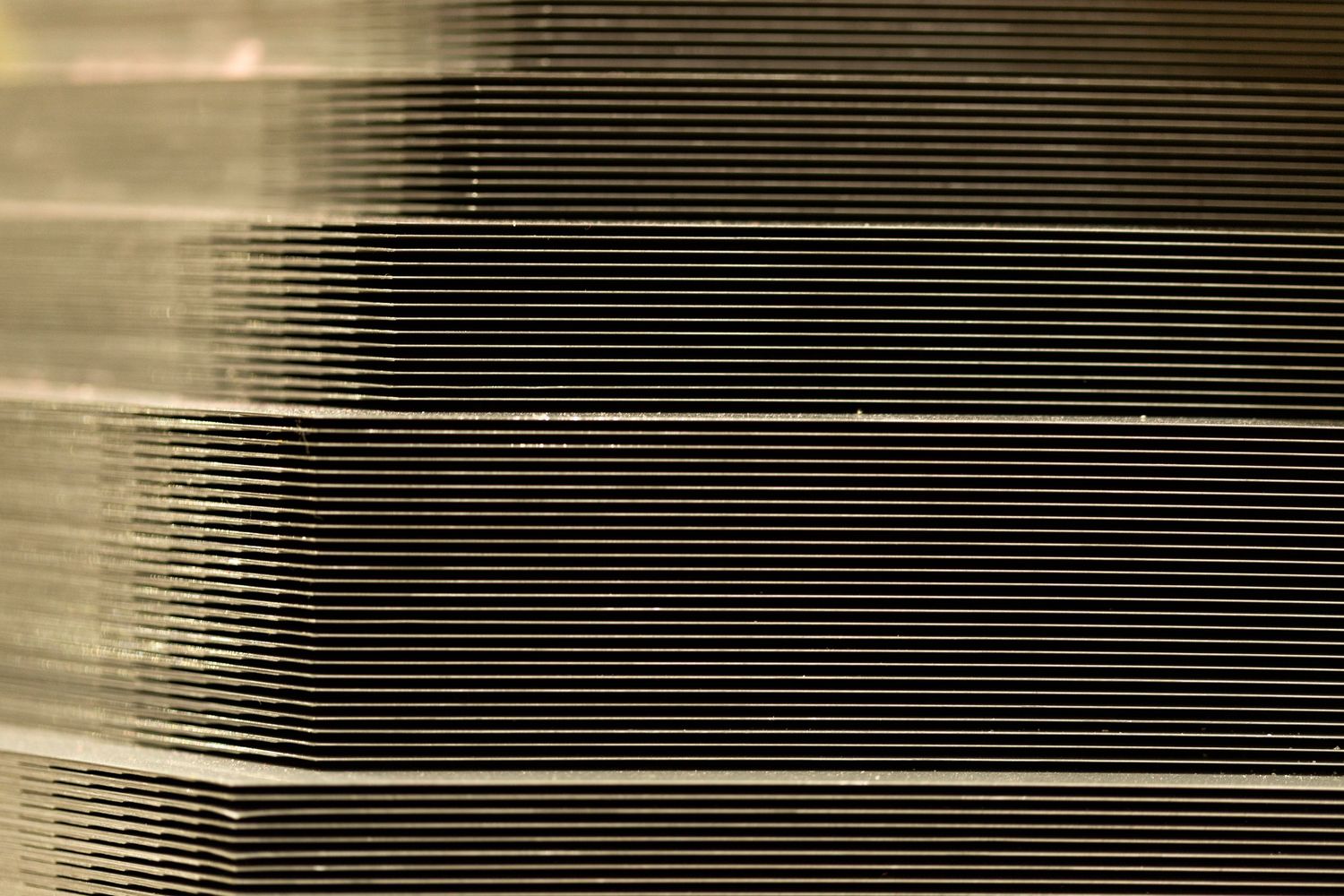 Abstract pattern of horizontal lines creating a striped effect in black and gray tones.