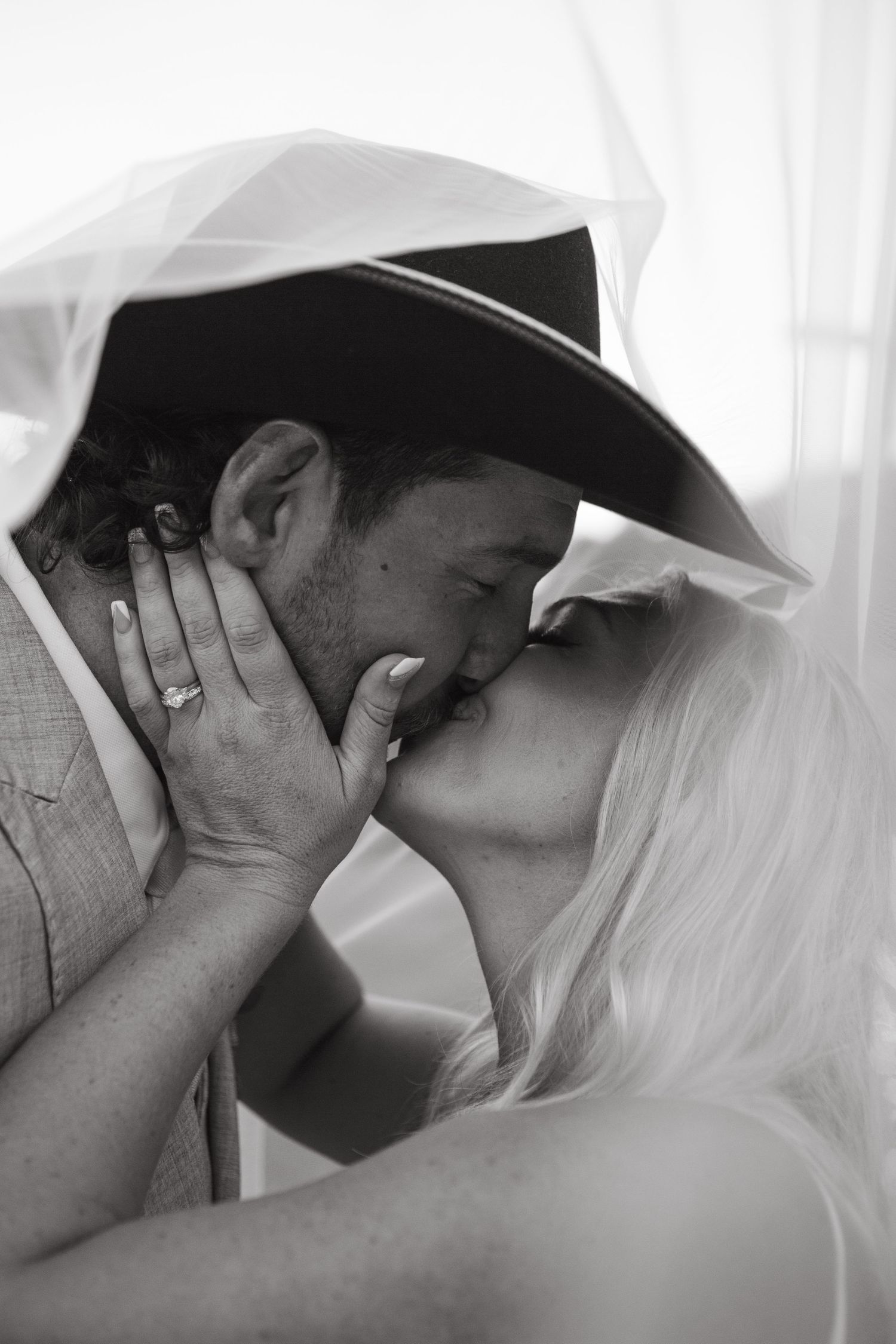 Bride and groom kissing under veil at country Port Douglas Wedding