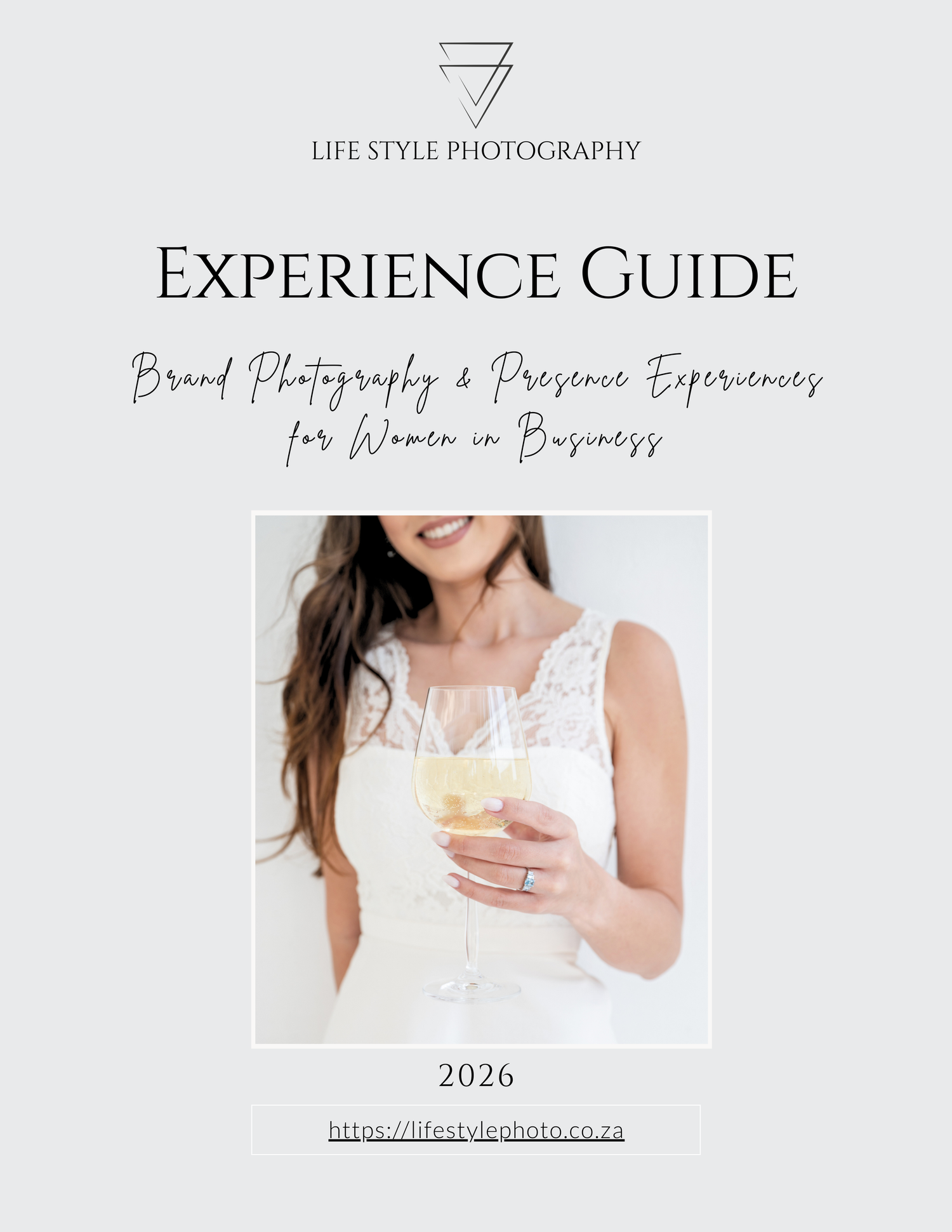Minimalist lifestyle photography experience guide cover with white dress and champagne glass against light gray background.