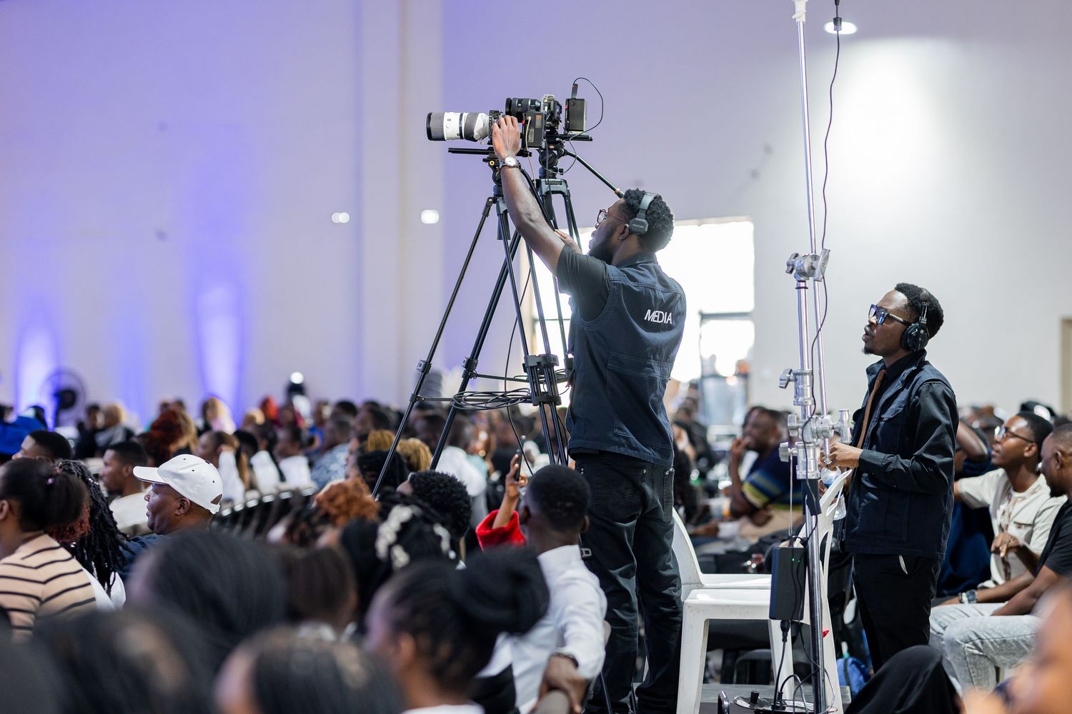 A series of event photos showing speakers and audience members at a professional conference or seminar.
