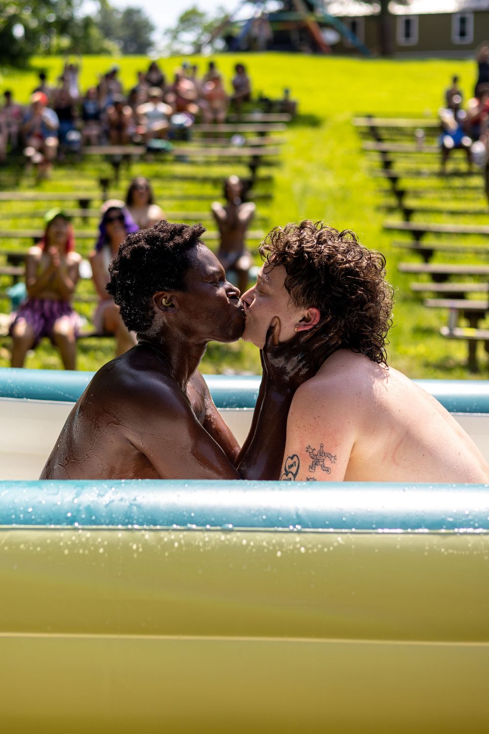 Queer embrace and intimacy at dyke camp in New York by trans photographer Kade Joy.