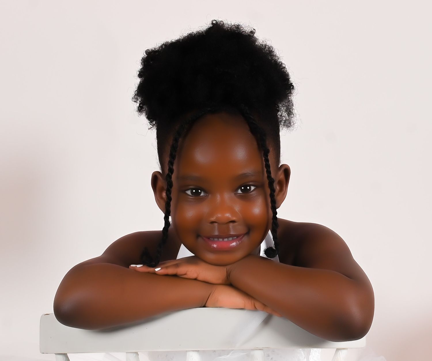 Professional headshot series against white background in studio setting.