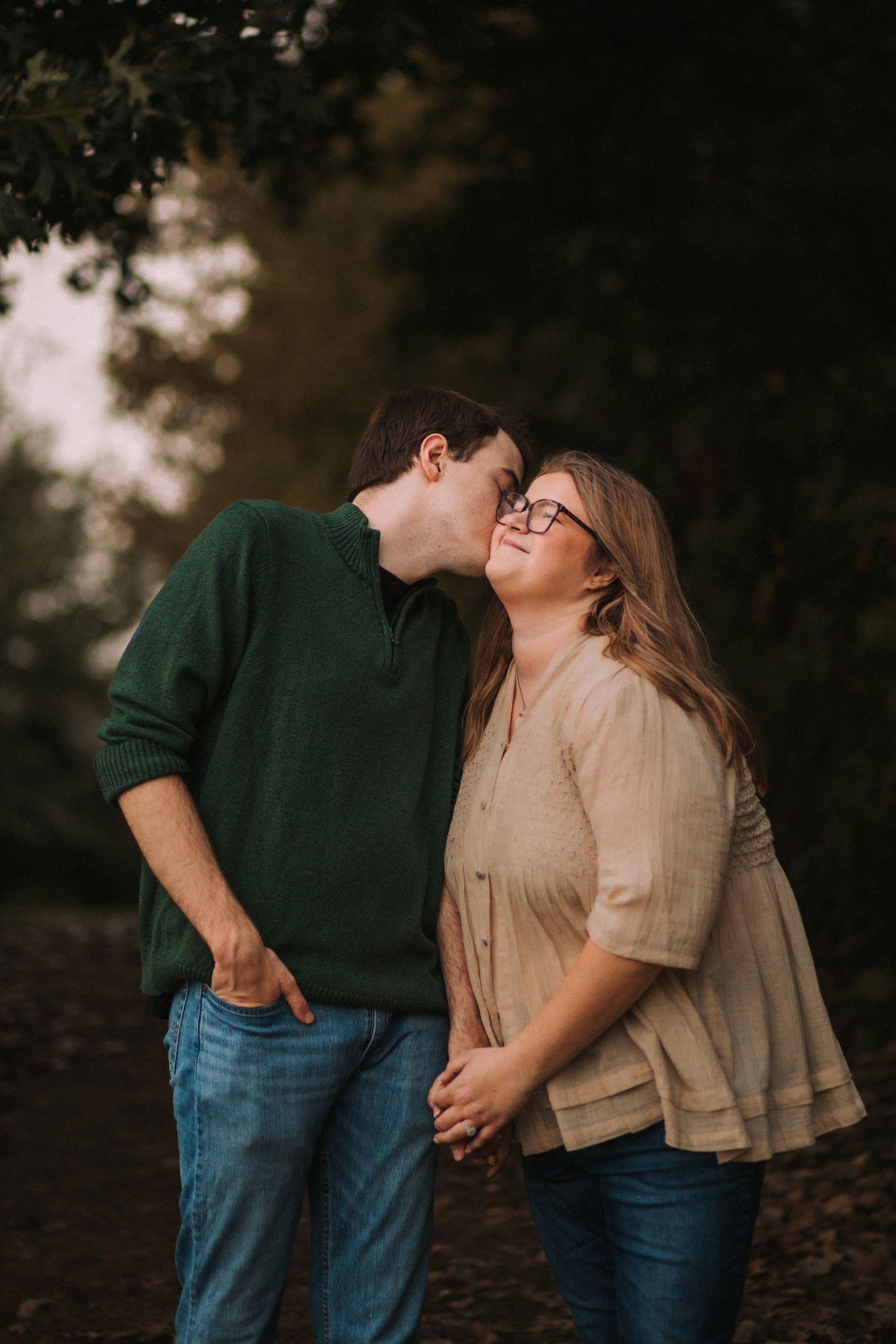 Casual couple shares intimate moments during golden hour photoshoot.